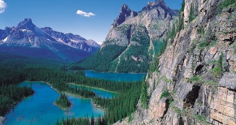 Rocky mountain cliffs and Lake O'Hara in Yoho National Park. (Photo credit: Tourism BC/JF Bergeron)