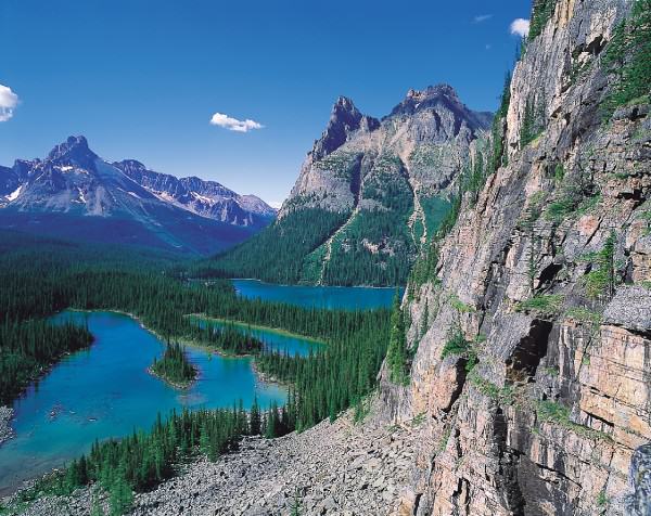 Rocky mountain cliffs and Lake O'Hara in Yoho National Park. (Photo credit: Tourism BC/JF Bergeron) Rocky mountain cliffs and Lake O'Hara in Yoho National Park. (Photo credit: Tourism BC/JF Bergeron)