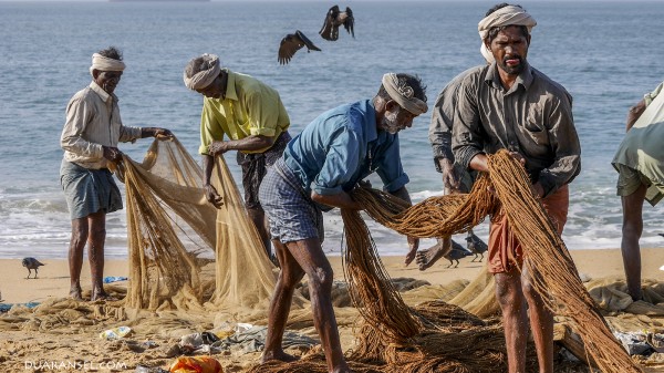 Indian fishermen at Kollam Beach, India