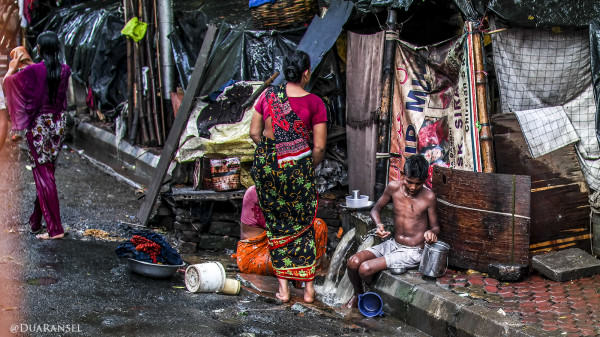 washing in sidewalk. Kolkata