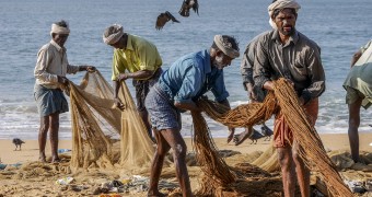 Indian fishermen at Kollam Beach, India